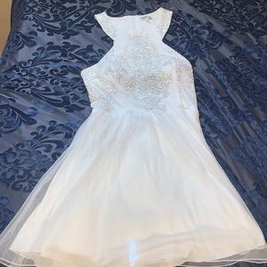 White dress with a hint of sparkle.